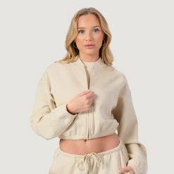 Bluza damska fitness z zamkiem bez kaptura migdałowa NEO. Brązowe bluzy sportowe damskie GYMBEAM, l, z bawełny. Za 116.90 zł.