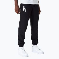 Spodnie męskie New Era MLB Essentls Jogger Los Angeles Dodgers. Czarne spodnie materiałowe męskie New Era, bez wzorów, sportowe. Za 199.99 zł.