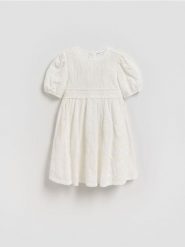Sukienka z cekinami - złamana biel. Sukienki dziewczęce Reserved, bez wzorów, z bawełny, bez ramiączek. Za 129.99 zł.