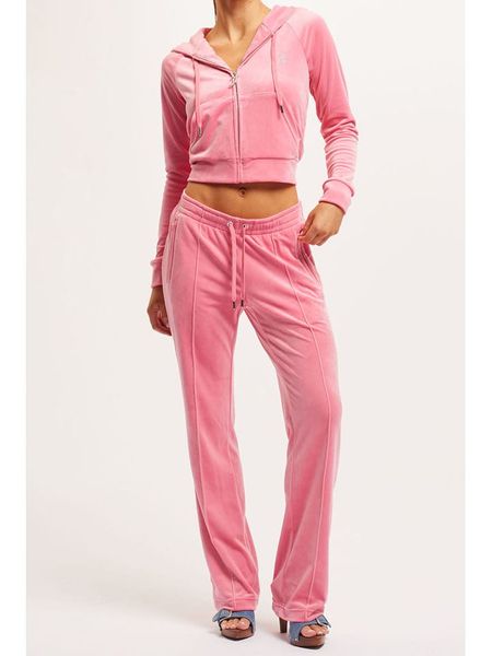 Juicy Couture Spodnie dresowe w kolorze jasnoróżowym rozmiar: XL. Różowe spodnie dresowe damskie Juicy Couture, xl, bez wzorów, z dresówki. Za 173.99 zł.