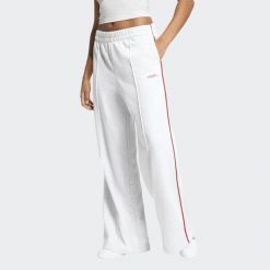 Spodnie damskie ADIDAS regular. Szare spodnie materiałowe damskie Adidas, bez wzorów, z bawełny, eleganckie. Za 239.99 zł.