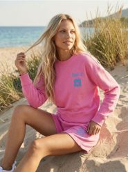 Bluza z napisem Make You Smile - różowy. Czerwone bluzy bez kaptura damskie Sinsay, l. Za 39.99 zł.