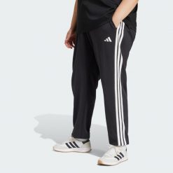 Spodnie Essentials 3-Stripes French Terry Cuffed. Białe spodnie dresowe damskie Adidas, l, z materiału, na fitness i siłownię. W wyprzedaży za 137.40 zł.