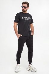 Spodnie dresowe męskie BALMAIN. Spodnie dresowe męskie Balmain, bez wzorów, z dresówki. W wyprzedaży za 2,714.25 zł.