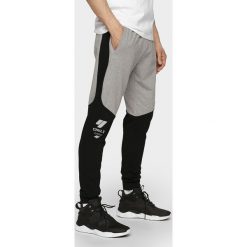Spodnie dresowe męskie SPMD205 - szary melanż. Szare spodnie dresowe męskie 4f, bez wzorów, z dresówki. Za 149.99 zł.