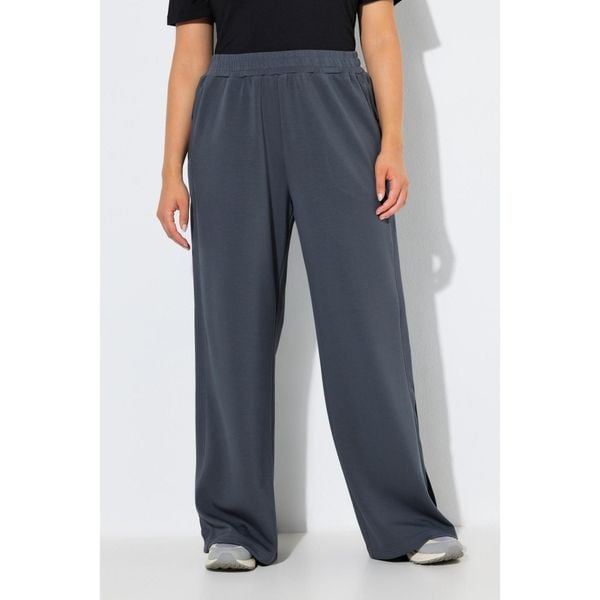 Damskie Spodnie dresowe rozcięcia po bokach szerokie nogawki elastyczny pas. Fioletowe spodnie dresowe damskie Ulla Popken, plus size, bez wzorów, z dresówki. Za 279.99 zł.