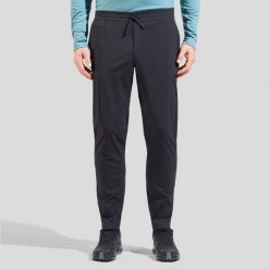 Spodnie męskie ODLO Essential Pants Regular Length. Niebieskie szorty męskie Odlo, na lato, bez wzorów, z poliamidu, sportowe. Za 391.95 zł.
