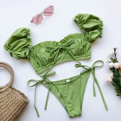Bikini z rękawkiem na lato z trwałego materiału Saskia. Czarne bikini damskie Intica, bez wzorów. Za 139.00 zł.