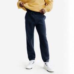 Spodnie męskie Elementals. Niebieskie spodnie materiałowe męskie Decathlon, bez wzorów, z bawełny. Za 149.99 zł.
