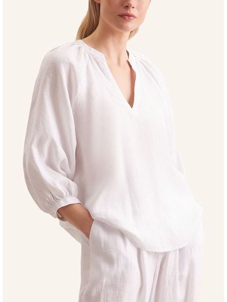 Seidensticker Lniana bluzka w kolorze białym rozmiar: 40. Białe bluzki damskie Seidensticker, bez wzorów, ze lnu, bez kołnierzyka, bez ramiączek. Za 222.94 zł.