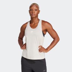 Koszulka fitness damska ADIDAS bez rękawów. Szare topy sportowe damskie Adidas, l, bez wzorów, z materiału, bez ramiączek. W wyprzedaży za 79.99 zł.