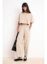 Trendyol Spodnie w kolorze beżowym rozmiar: Standart. Brązowe spodnie materiałowe damskie Trendyol, bez wzorów, z bawełny. Za 95.99 zł.