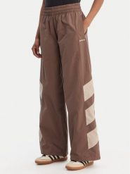 Adidas Spodnie dresowe Blocked Washed KD8790 Brązowy Loose Fit. Brązowe spodnie dresowe damskie Adidas, l, bez wzorów, z dresówki. Za 349.99 zł.