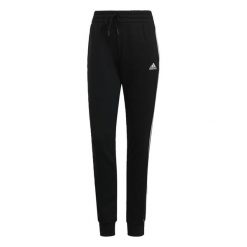 Spodnie damskie adidas ESSENTIAL 3-STRIPES. Białe spodnie sportowe damskie Adidas, s, z bawełny, na fitness i siłownię. Za 129.99 zł.