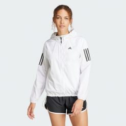 Kurtka Own The Run. Białe kurtki damskie Adidas, xs, bez wzorów, z materiału, bez kaptura. W wyprzedaży za 223.72 zł.