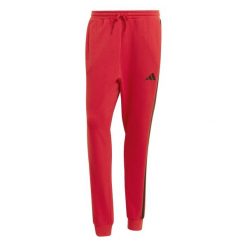 Spodnie Mężczyzna Adidas Essential 3 Stripes czerwony. Czerwone spodnie sportowe męskie Adidas, z bawełny. Za 222.40 zł.