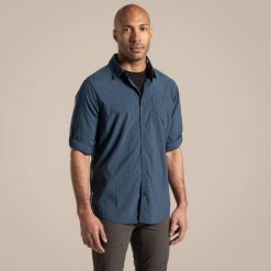 Koszula podróżnicza męska Craghoppers NosiLife Nuoro LS Shirt II. Niebieskie koszule męskie CRAGHOPPERS, na lato, m, bez wzorów, bez kołnierzyka, bez ramiączek. Za 291.49 zł.