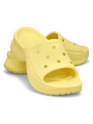 Crocs Klapki "Bae Slide" w kolorze żółtym rozmiar: 41/42. Żółte klapki damskie Crocs, bez wzorów, bez obcasa. Za 152.62 zł.