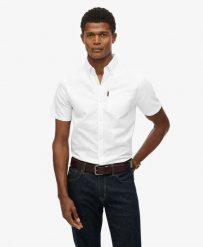 Superdry Koszula Oxford krótkiego rękawa z bawełny organicznej. Białe koszule damskie Superdry., m, bez wzorów, z bawełny, bez kołnierzyka, bez ramiączek. Za 279.65 zł.
