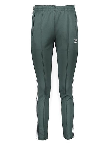 Adidas Spodnie dresowe w kolorze zielonym rozmiar: 34. Zielone spodnie dresowe damskie Adidas, bez wzorów, z dresówki. Za 82.83 zł.
