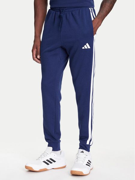 Adidas Spodnie dresowe Essential 3-Stripes JD1878 Niebieski Regular Fit. Niebieskie spodnie dresowe męskie Adidas, bez wzorów, z dresówki. Za 189.99 zł.