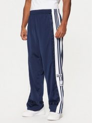 Adidas Spodnie dresowe Adibreak JD4268 Granatowy Loose Fit. Niebieskie spodnie dresowe męskie Adidas, bez wzorów, z dresówki. Za 329.99 zł.