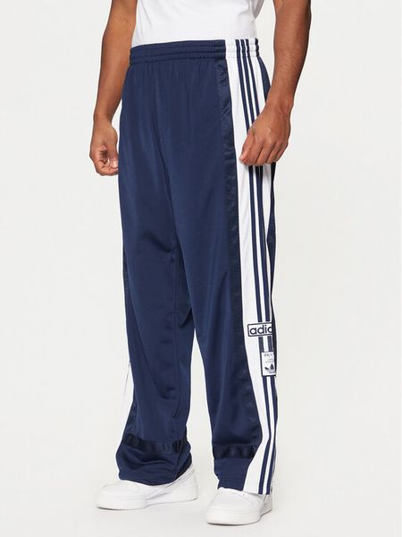 Adidas Spodnie dresowe Adibreak JD4268 Granatowy Loose Fit. Niebieskie spodnie dresowe męskie Adidas, bez wzorów, z dresówki. Za 239.99 zł.