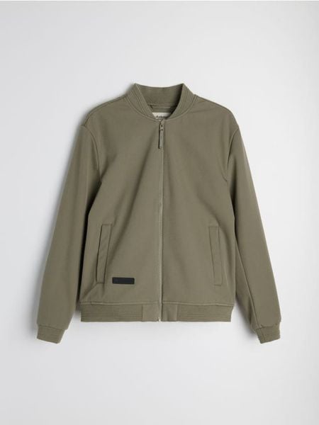Kurtka softshell bomber - zielony. Zielone kurtki softshell damskie Sinsay, l, bez wzorów, z softshellu, bez kaptura. Za 99.99 zł.