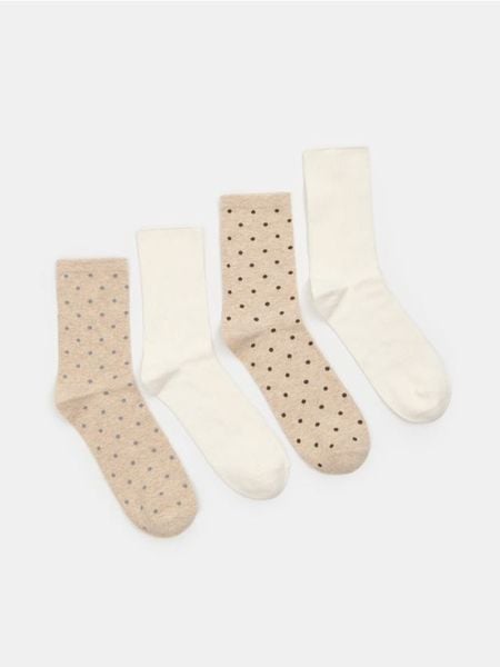Skarpetki z bawełną 4 pack - kremowy. Białe skarpetki damskie Sinsay, bez wzorów, z bawełny. Za 15.99 zł.