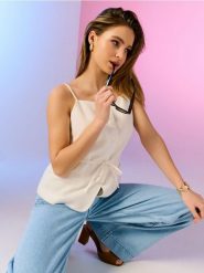 Kamizelka na cienkich ramiączkach z wiskozą i domieszką lnu - kremowy. Białe kamizelki damskie Sinsay, l, z wiskozy. Za 59.99 zł.