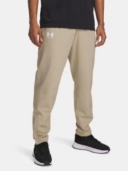 Under Armour Spodnie funkcyjne "Rival" w kolorze beżowym rozmiar: S. Brązowe spodnie materiałowe męskie Under Armour. Za 126.45 zł.