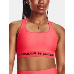 Stanik fitness Under Armour Crossback Mid. Czerwone biustonosze sportowe damskie Under Armour, bez wzorów. Za 78.99 zł.