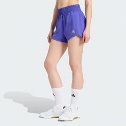 Szorty Racer Pacer z tkaniny plecionej. Fioletowe szorty damskie Adidas, bez wzorów, z elastanu, klasyczne, z podwyższonym stanem. Za 179.00 zł.