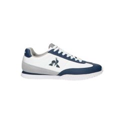Tenisówki Le Coq Sportif Model Veloce Kolor Biały. Niebieskie trampki i tenisówki damskie Le Coq Sportif, bez wzorów, ze skóry. Za 307.75 zł.