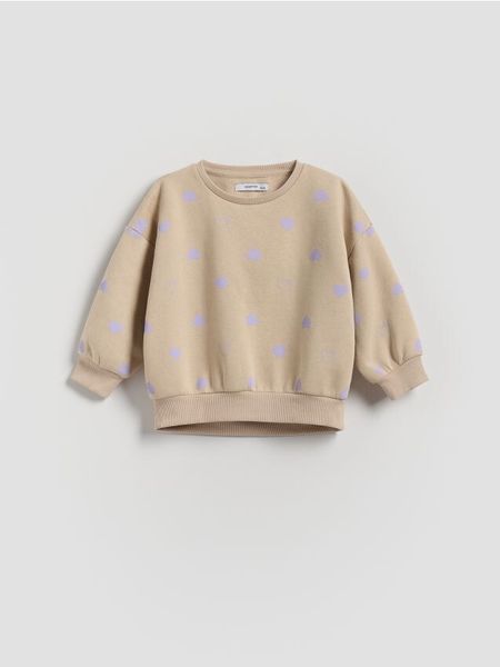 Bawełniana bluza we wzór - beżowy. Brązowe bluzy i bluzki niemowlęce Reserved, bez wzorów, z bawełny, bez ramiączek, bez kaptura. W wyprzedaży za 27.99 zł.
