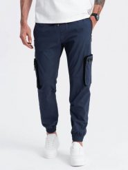 Męskie spodnie JOGGERY z zapinanymi kieszeniami cargo - granatowe V5 OM-PAJO-0135 - XXL. Niebieskie spodnie materiałowe męskie Ombre Clothing, bez wzorów, z bawełny, wizytowe. Za 113.99 zł.