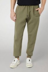 GUESS Zielone męskie spodnie dresowe z lampasami Mickey. Zielone spodnie dresowe męskie Guess, z aplikacjami, z bawełny. W wyprzedaży za 355.99 zł.