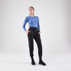 Spodnie do biegania damskie Kiprun Run 500 Warm ocieplane. Czarne spodnie materiałowe damskie KIPRUN, bez wzorów, z elastanu, sportowe. Za 139.99 zł.