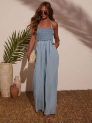 Milan Kiss Kombinezon dżinsowy w kolorze błękitnym rozmiar: M. Niebieskie kombinezony damskie Milan Kiss, m, bez wzorów, z bawełny, bez kołnierzyka, bez ramiączek. Za 217.99 zł.