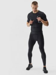 4F Legginsy treningowe ze średnim stanem męskie - czarne M. Czarne spodnie sportowe męskie 4f, z dzianiny. W wyprzedaży za 99.99 zł.
