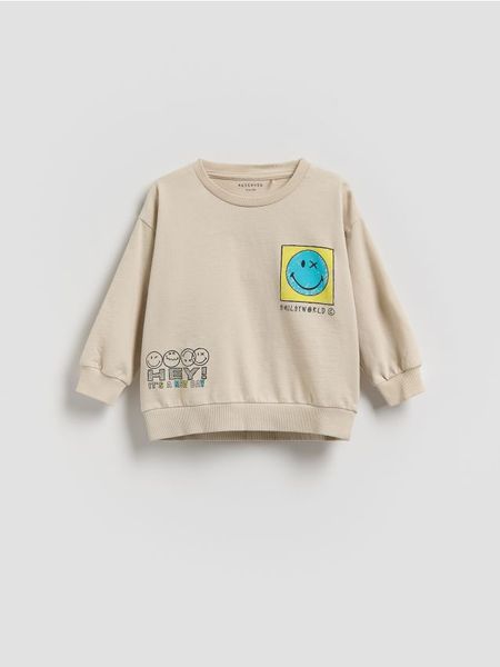 Bluza SmileyWorld® - jasnoszary. Szare bluzy i bluzki niemowlęce Reserved, bez wzorów, z bawełny, bez ramiączek, bez kaptura. Za 49.99 zł.
