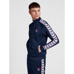 Bluza dresowa zapinana na zamek błyskawiczny Hummel IC Lerby Poly. Niebieskie bluzy sportowe damskie HUMMEL, xs, bez wzorów, z dresówki, bez ramiączek, długie, bez kaptura. Za 299.00 zł.