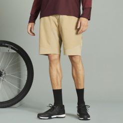 Szorty rowerowe MTB Rockrider Cargo. Czarne szorty męskie ROCKRIDER, bez wzorów, z materiału, sportowe. Za 179.99 zł.