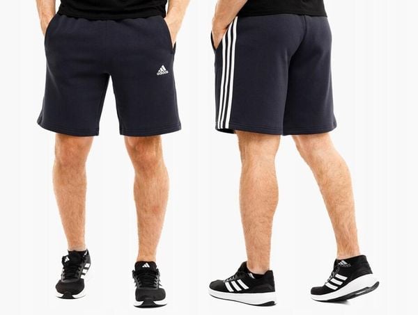 Spodenki męskie adidas Essentials Fleece 3-Stripes Shorts. Niebieskie szorty męskie Adidas, bez wzorów, z bawełny, klasyczne. Za 134.99 zł.