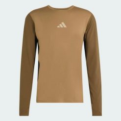 Syntetyczna koszulka TERREX MULTI, pełniąca funkcję warstwy podstawowej. Brązowe koszulki męskie z długim rękawem Adidas, l, z dzianiny. Za 219.00 zł.