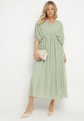 Zielona Sukienka Rozkloszowana z Wiązaniem na Szyi o Luźnym Kroju Napila. Zielone sukienki damskie Born2be, na co dzień, l, bez wzorów, eleganckie, bez kołnierzyka, bez ramiączek, maxi, rozkloszowane. W wyprzedaży za 127.99 zł.