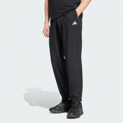 Spodnie Essentials Small Logo Stanford Lite Woven Tapered Cuffed. Białe spodnie materiałowe męskie Adidas, bez wzorów, z materiału, klasyczne, z standardowym stanem. Za 179.00 zł.