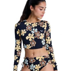 Krótka koszulka z długim rękawem rashguard damska THE BEACH BABE. Czarne bikini damskie Roxy, xl, bez wzorów, z elastanu, bez kołnierzyka. Za 259.99 zł.