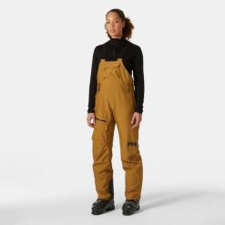 Damskie spodnie narciarskie na szelkach Helly Hansen Powderqueen. Brązowe spodnie dresowe damskie Helly Hansen, na zimę, bez wzorów. W wyprzedaży za 1,208.00 zł.