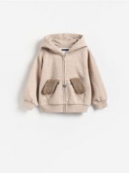 Bluza z kapturem - beżowy. Brązowe bluzy i bluzki niemowlęce Reserved, bez wzorów, z bawełny, bez ramiączek, z kapturem. Za 59.99 zł.